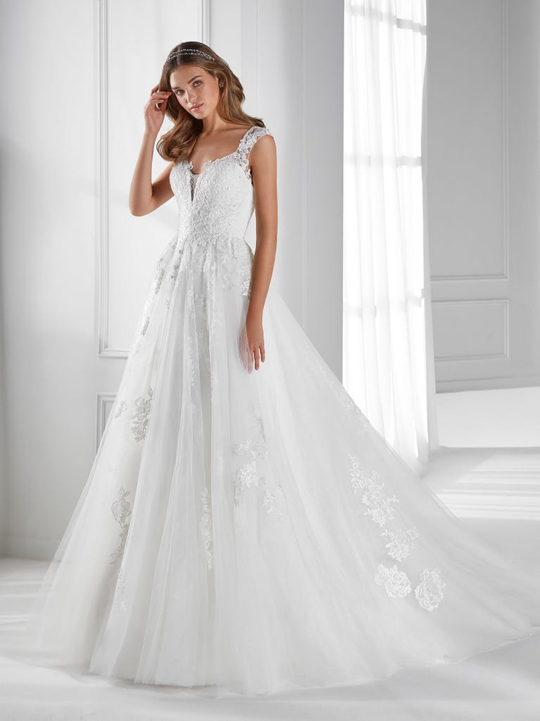 Sleeveless A-line organza wedding dress with plunging V-neck. The lace on the bodice is romantic yet modern.