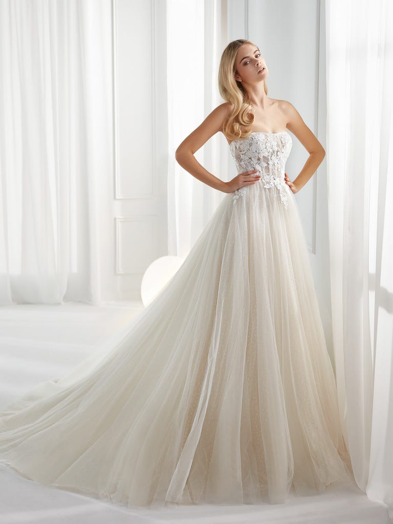 Sleeveless A-line organza wedding dress with plunging V-neck. The lace on the bodice is romantic yet modern.