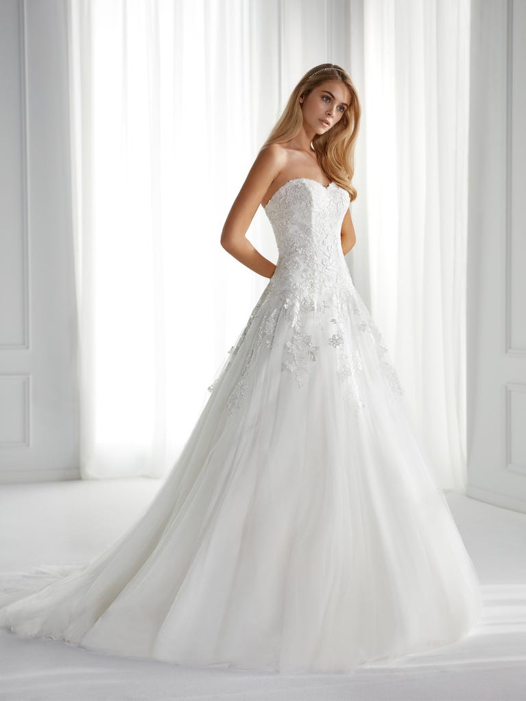 Sleeveless A-line organza wedding dress with plunging V-neck. The lace on the bodice is romantic yet modern.