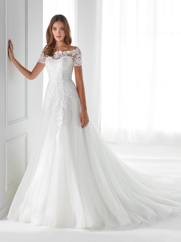 Sleeveless A-line organza wedding dress with plunging V-neck. The lace on the bodice is romantic yet modern.