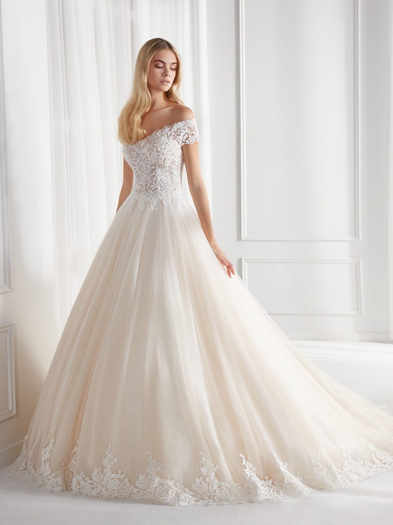 Sleeveless A-line organza wedding dress with plunging V-neck. The lace on the bodice is romantic yet modern.