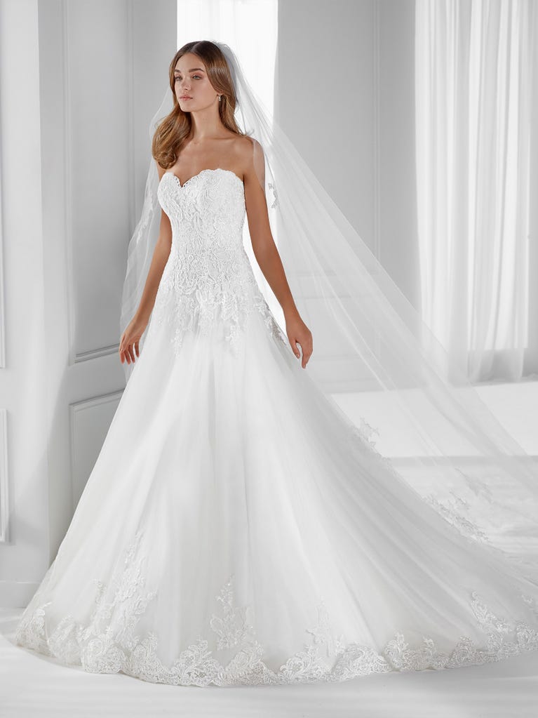 Sleeveless A-line organza wedding dress with plunging V-neck. The lace on the bodice is romantic yet modern.