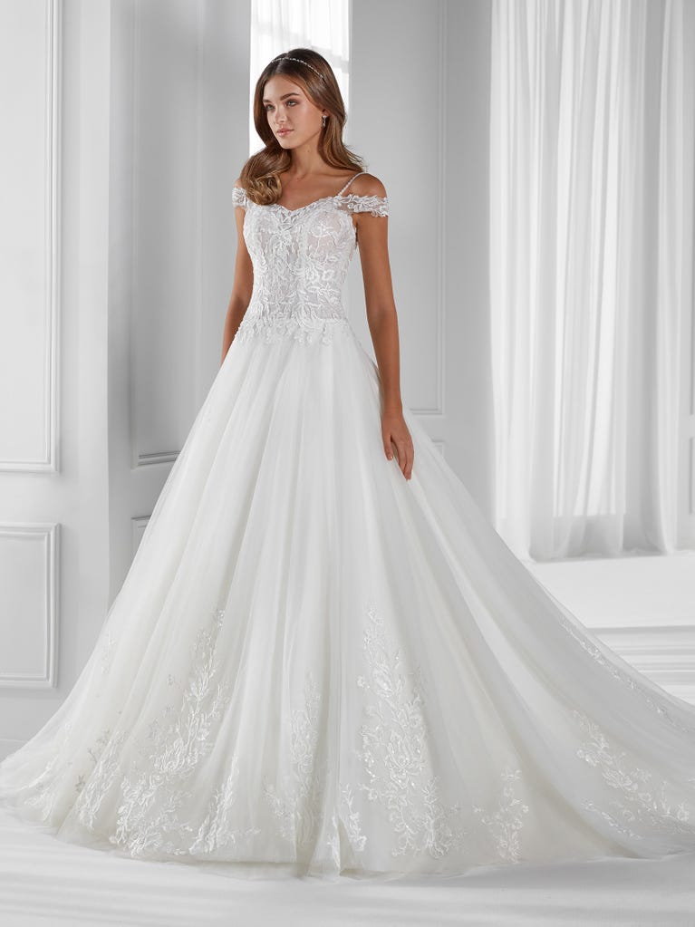 Sleeveless A-line organza wedding dress with plunging V-neck. The lace on the bodice is romantic yet modern.