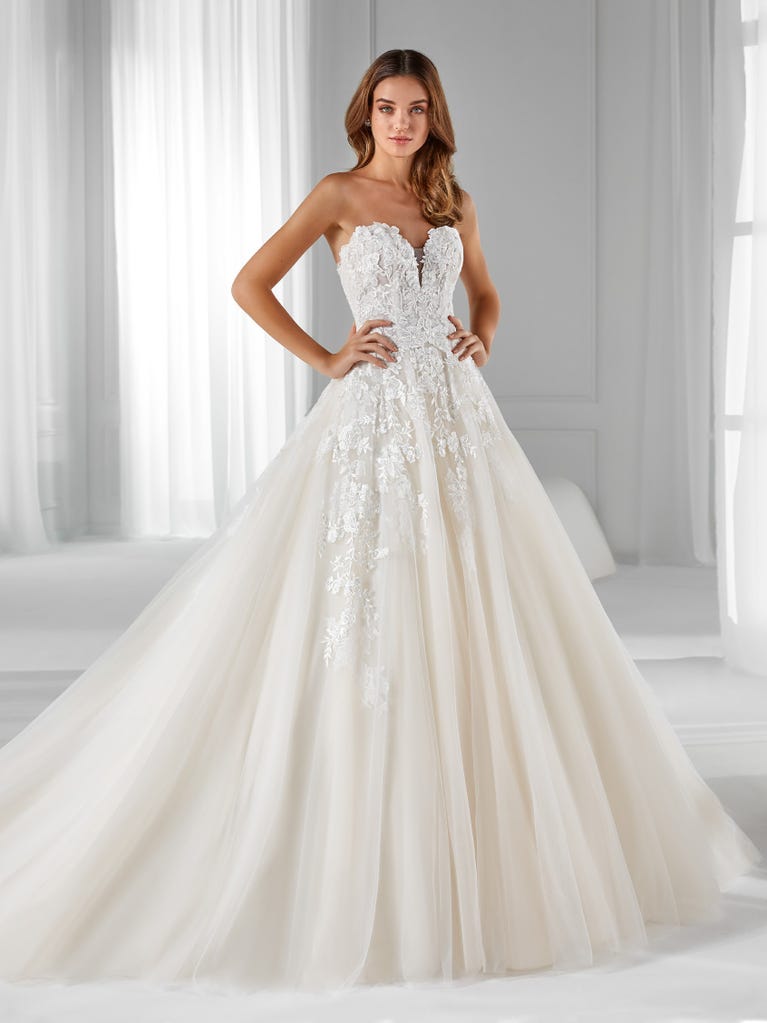 Sleeveless A-line organza wedding dress with plunging V-neck. The lace on the bodice is romantic yet modern.