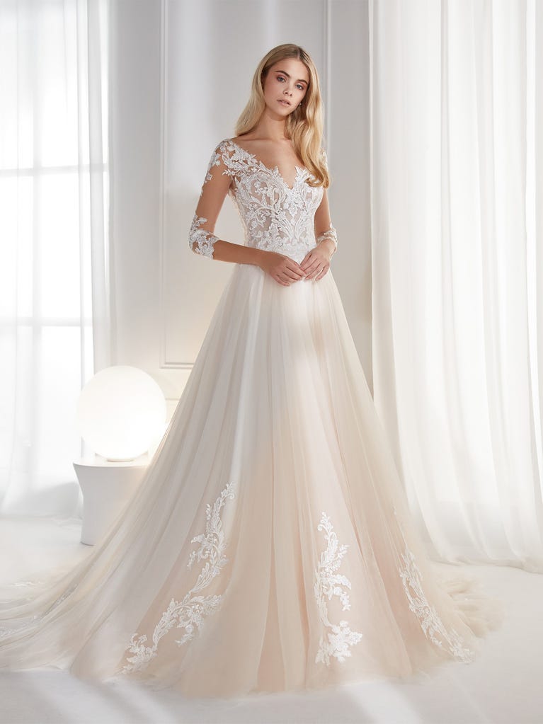 Sleeveless A-line organza wedding dress with plunging V-neck. The lace on the bodice is romantic yet modern.
