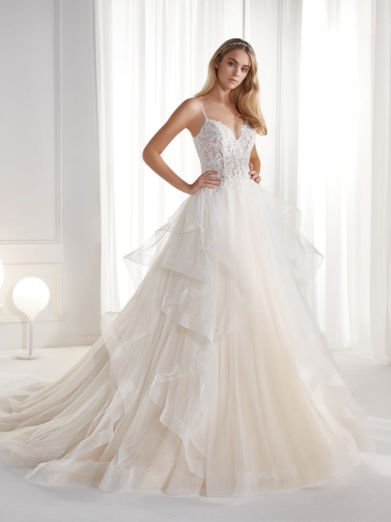 Sleeveless A-line organza wedding dress with plunging V-neck. The lace on the bodice is romantic yet modern.
