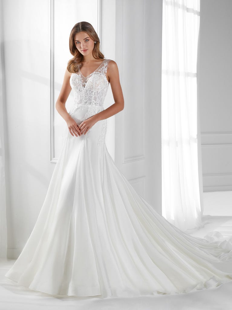 Sleeveless A-line organza wedding dress with plunging V-neck. The lace on the bodice is romantic yet modern.