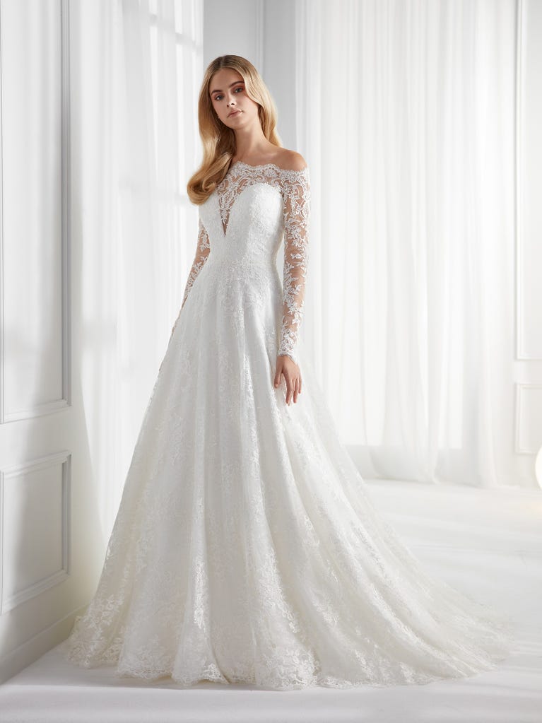 Sleeveless A-line organza wedding dress with plunging V-neck. The lace on the bodice is romantic yet modern.