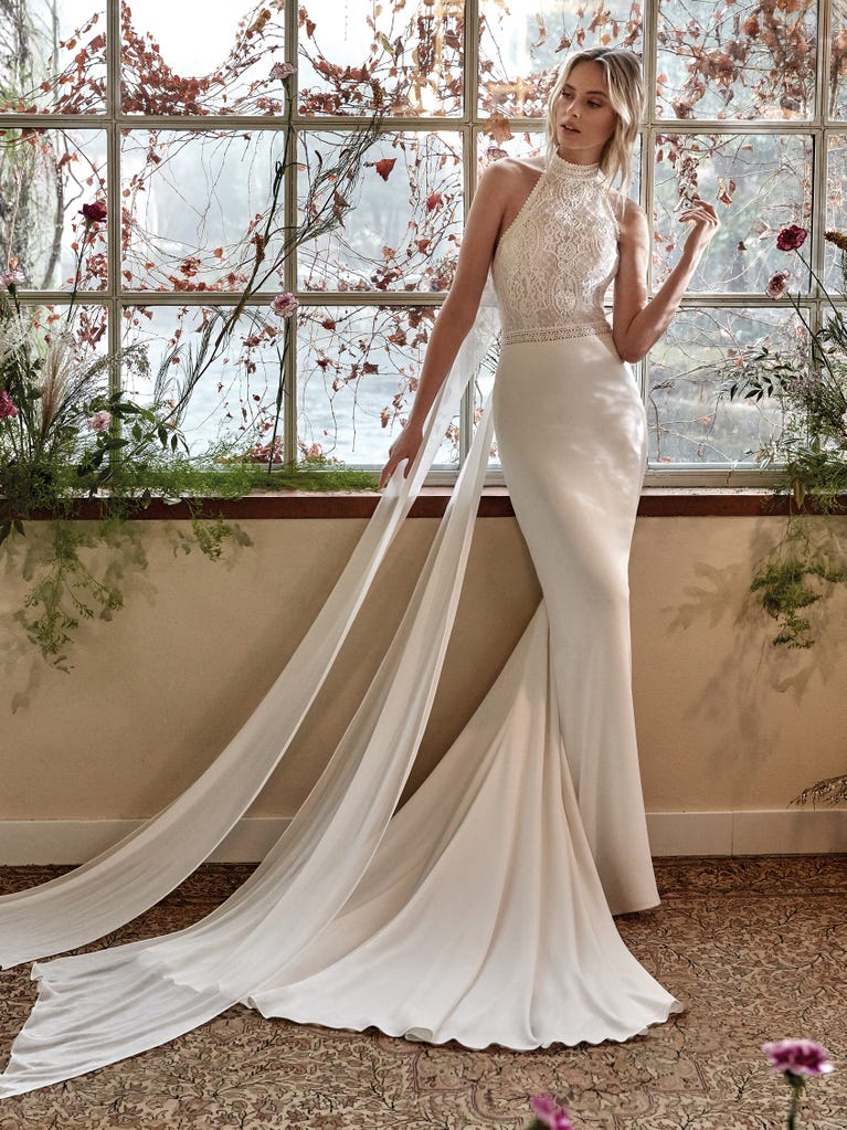 Fit & flare champagne tulle wedding dress with off-white guipure lace floral designs. The rounded neckline with tattoo-effect lace is highlighted with a refined, romantic 3D flower on the shoulder.